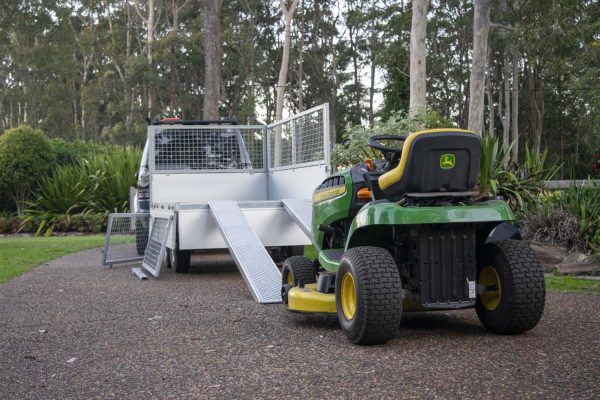 John Deere mower on Variant proline trailer with ramps and cage sides - gardeners best tools.