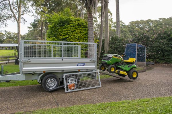 John Deere mower on Variant proline trailer with ramps and cage sides - gardeners best tools.